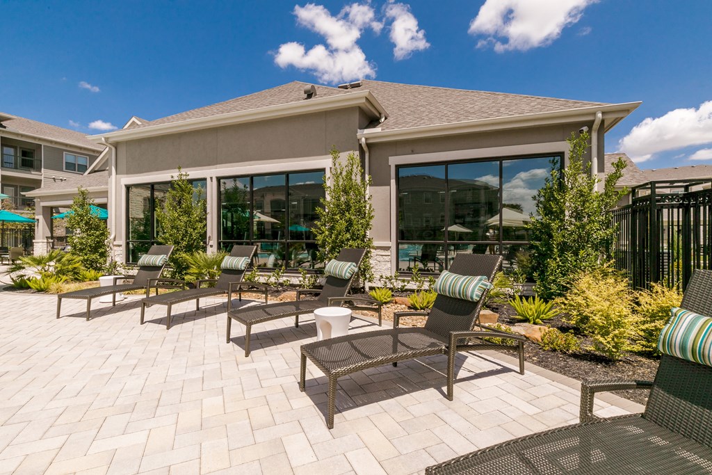 Poolside Sundeck With Relaxing Chairs at Cue Luxury Apartments, Cypress, 77433