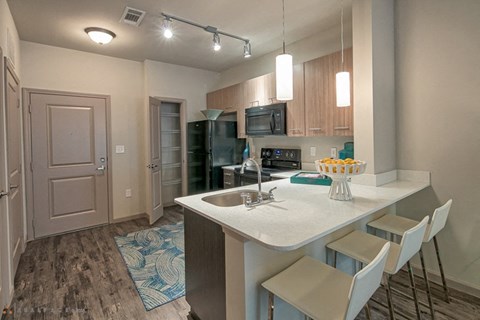 a kitchen with a counter top and a sink