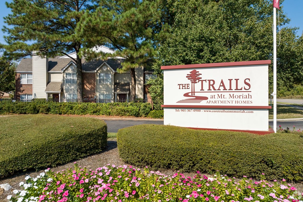 the trails at the north apartments sign at the trails in the month of april