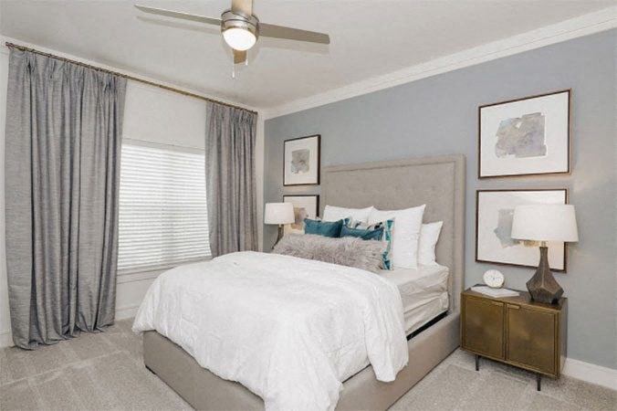 Bedroom With Ceiling Fan at Cue Luxury Apartments, Cypress