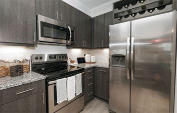 Fully Furnished Kitchen at Cue Luxury Apartments, Cypress, TX