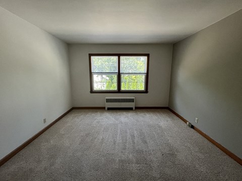 an empty room with a window in it