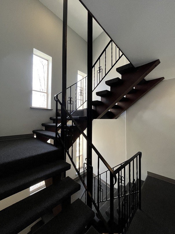 a staircase in a house with black stairs