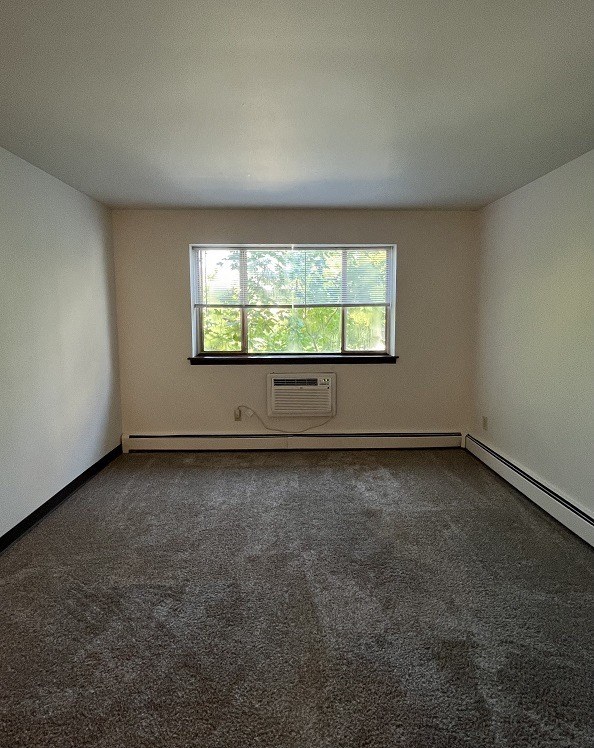 the living room of an empty house with a window