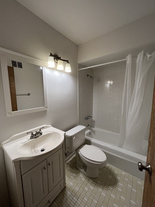 a small bathroom with a sink toilet and shower