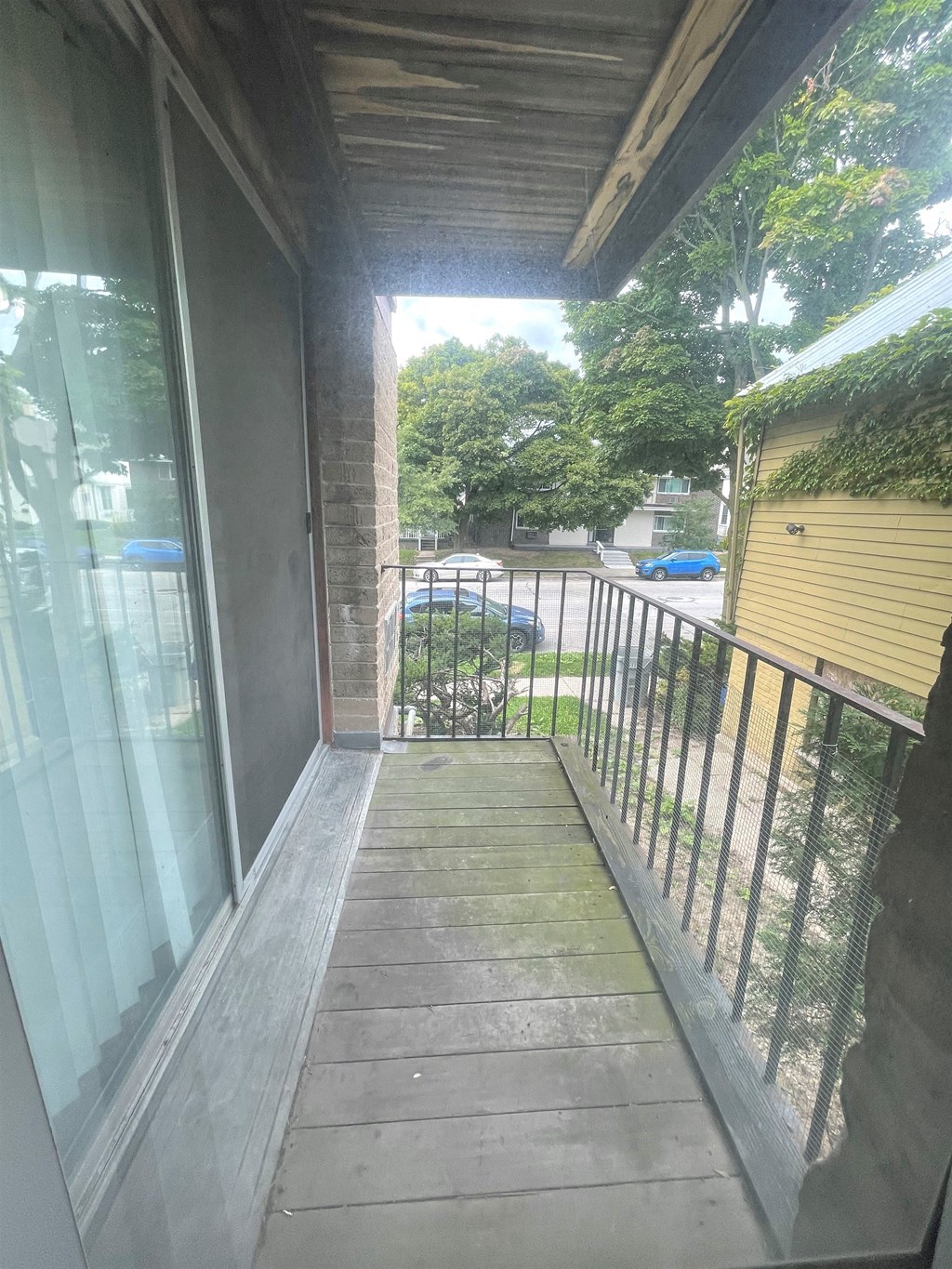 a view of the balcony from the front of the house