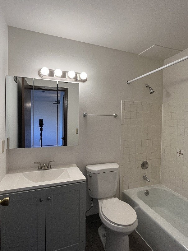 a bathroom with a sink toilet and a mirror