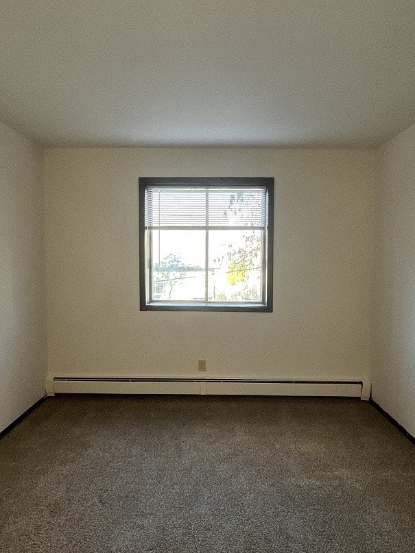an empty room with a window in it