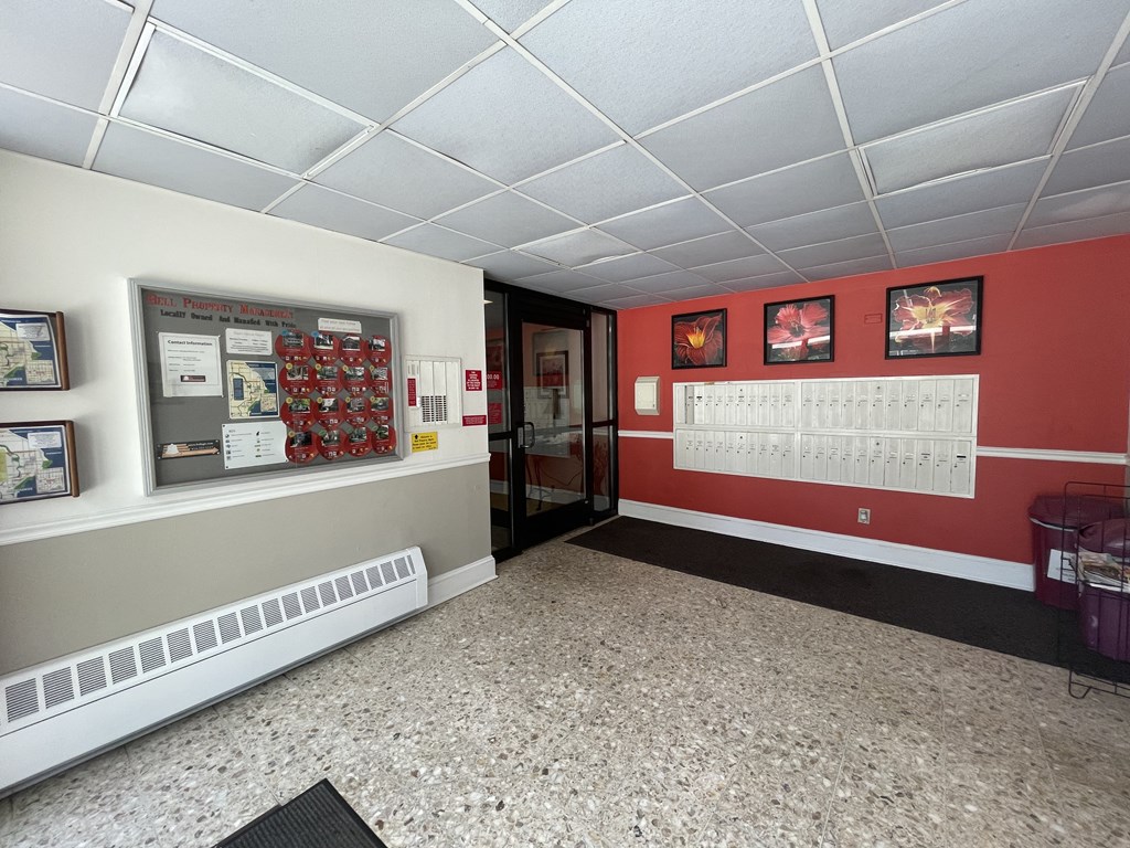a room with a red wall and a white ceiling