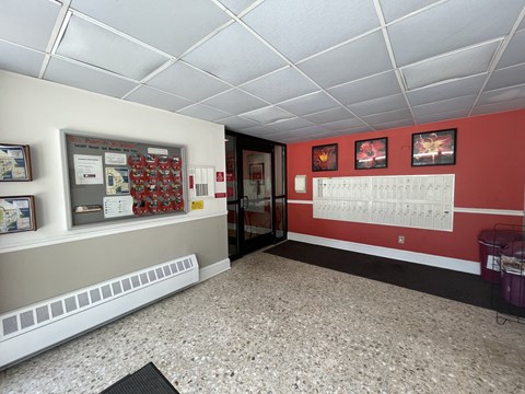 a room with a red wall and a white ceiling