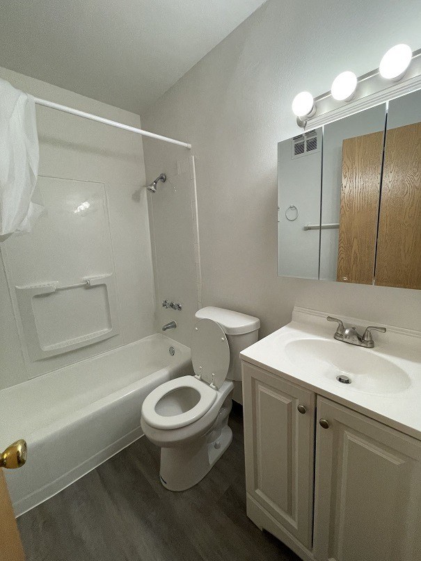 a bathroom with a sink toilet and bathtub