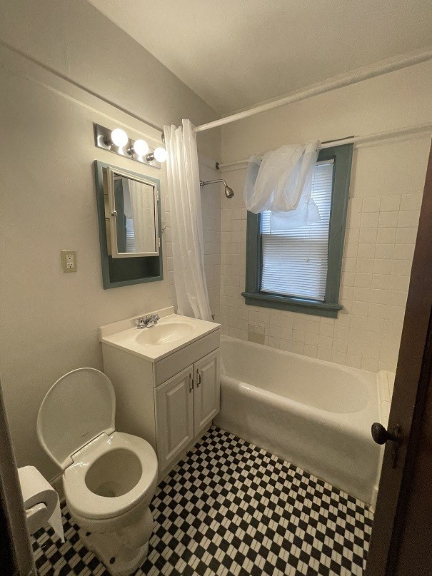 a bathroom with a toilet sink and bathtub