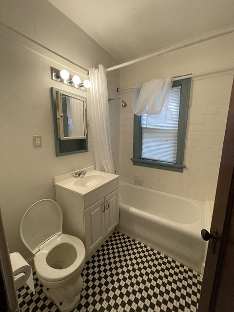 a bathroom with a toilet sink and bathtub