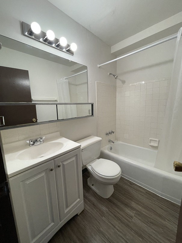 a bathroom with a sink toilet and a bath tub