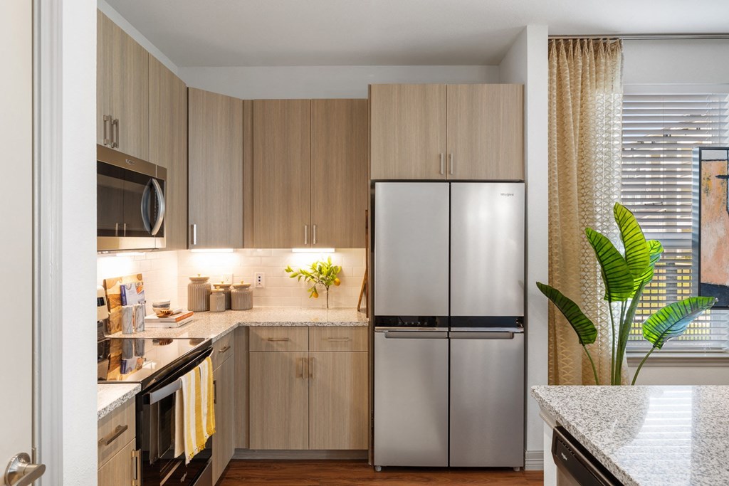 Kitchen with stainless steel appliances and custom cabinetry