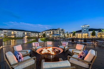 Lakeside fire pit surrounded by comfortable seating - Photo Gallery 34