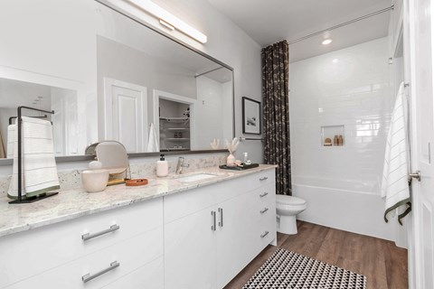 Apartment bathroom with vanity, soaking tub
