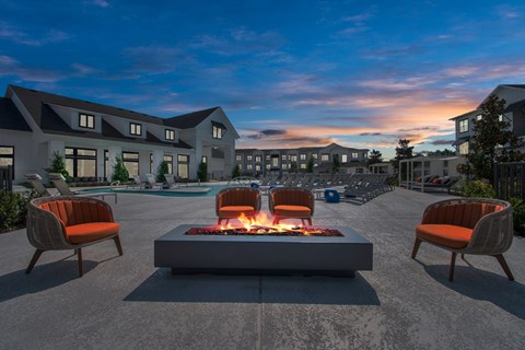 Cozy firepit and seating on the poolside patio 