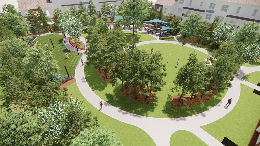 A park with a circular walking path and trees.