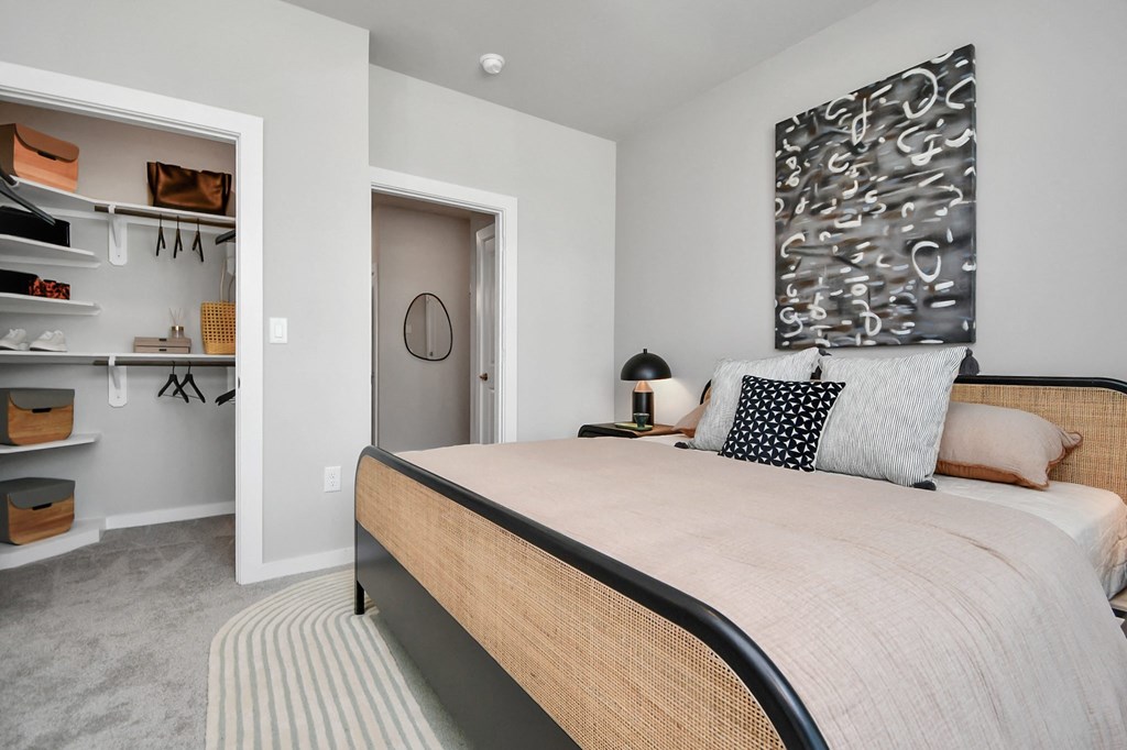 a bedroom with a large bed and a closet