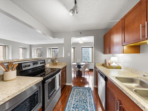 A kitchen with a stove top oven and a dishwasher.