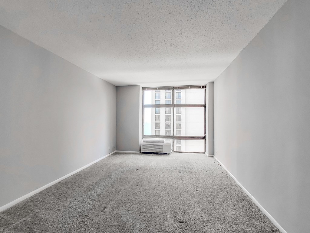 an empty room with a large window