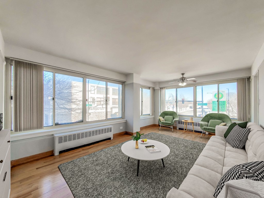 a living room with a large window and a couch