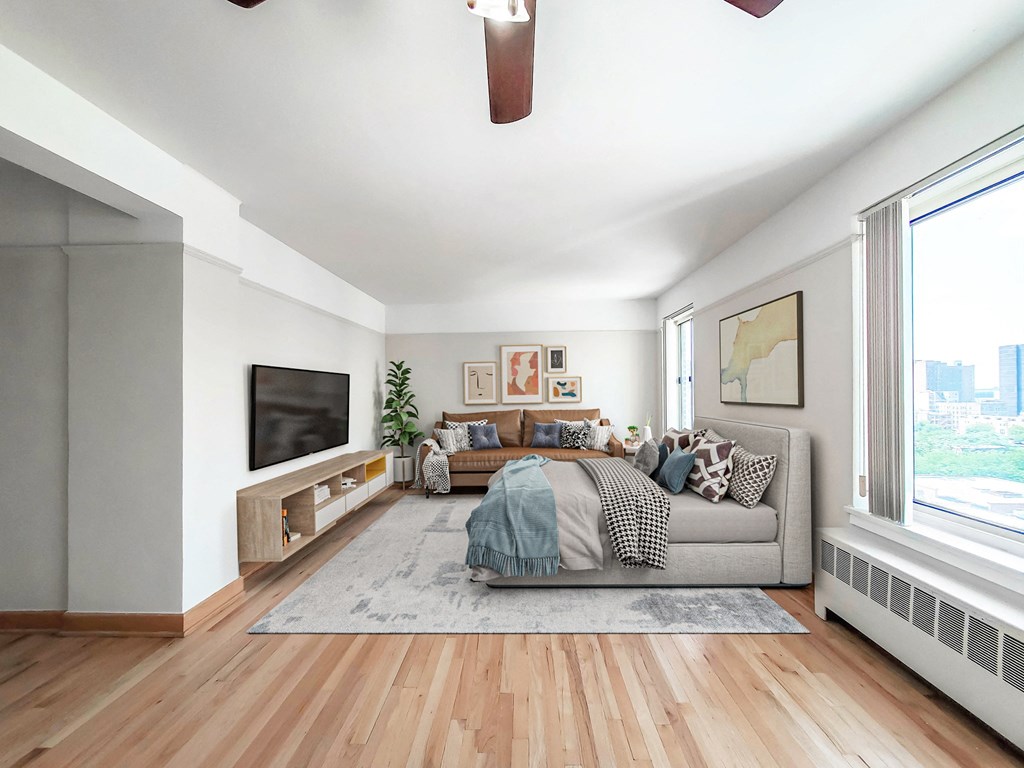 a bedroom with a large bed and a large window