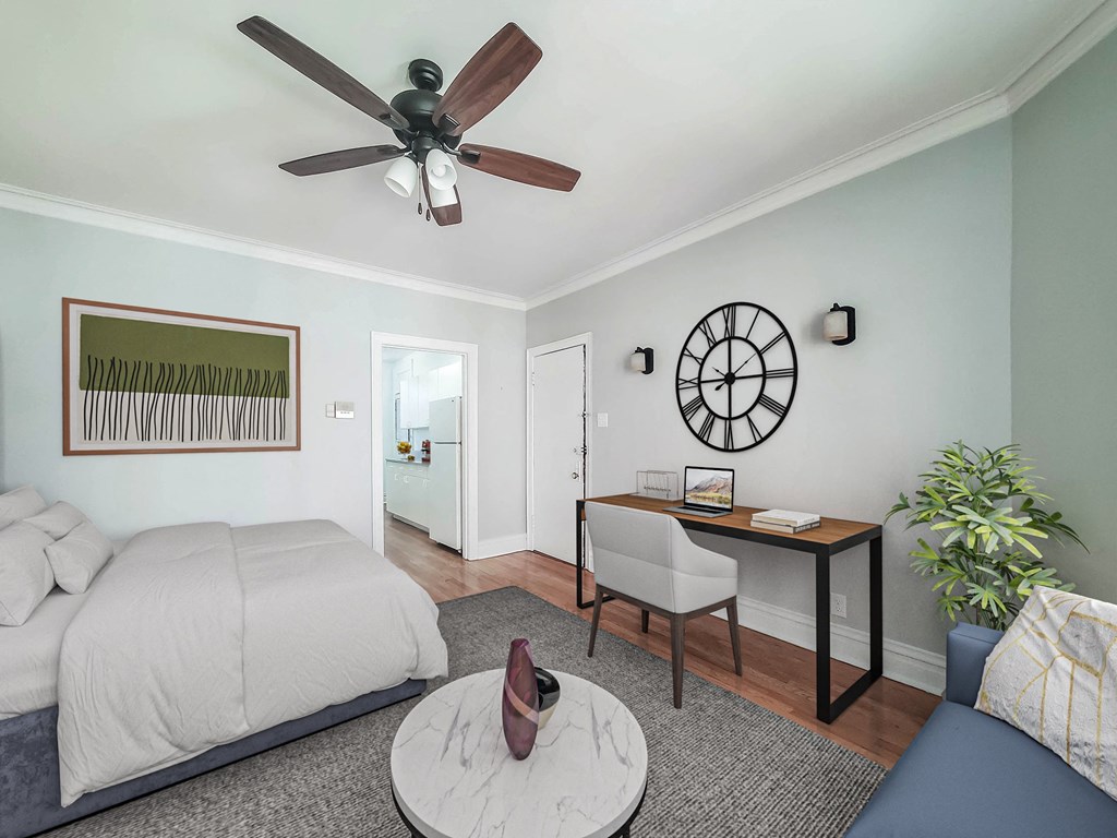 a bedroom with a bed and a ceiling fan