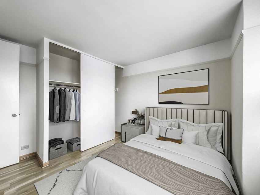 a bedroom with a bed and a closet - Photo Gallery