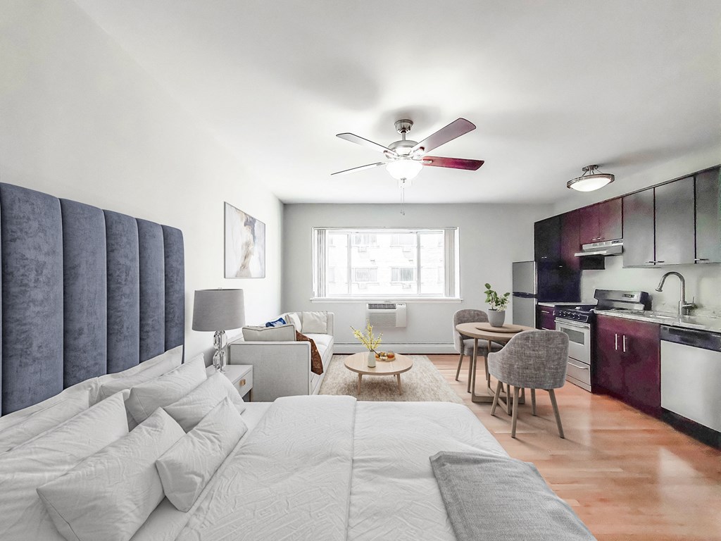 a bedroom with a bed and a ceiling fan