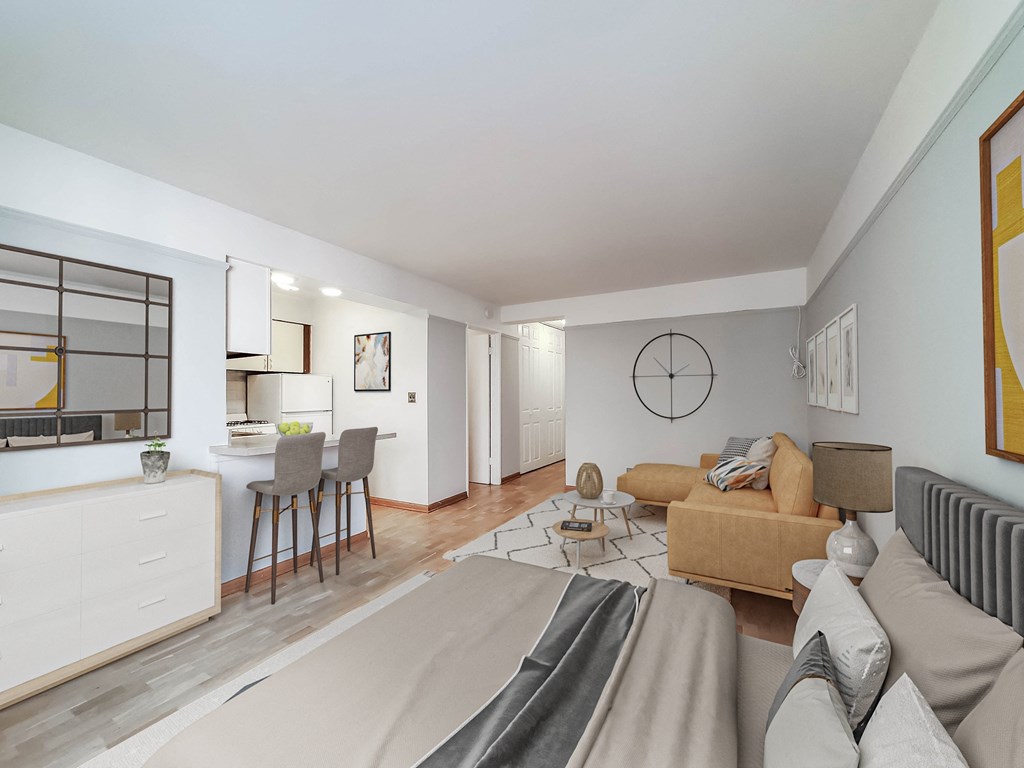 a bedroom with a bed sitting next to a living room