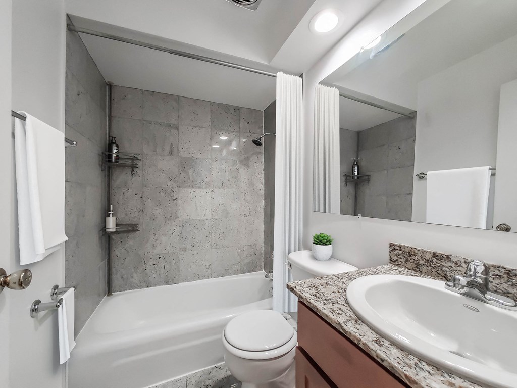 a bathroom with a toilet sink and bathtub