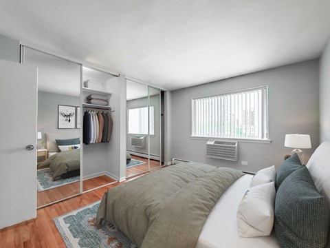 a bedroom with a large bed and a large mirror