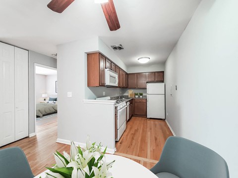 a kitchen and dining area in a 555 waverly unit