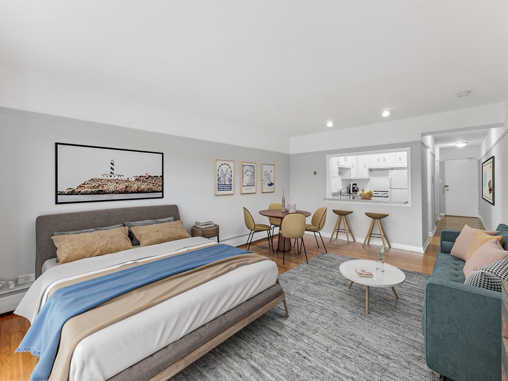 a bedroom with a bed and a chair in a room