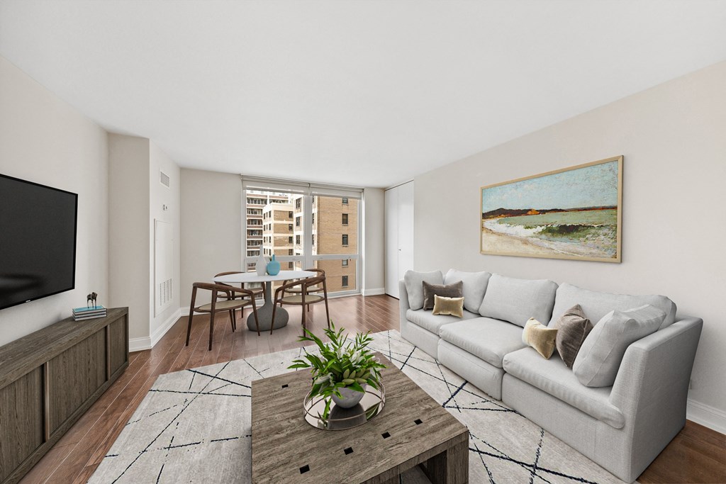 a living room with a couch and a table and a tv