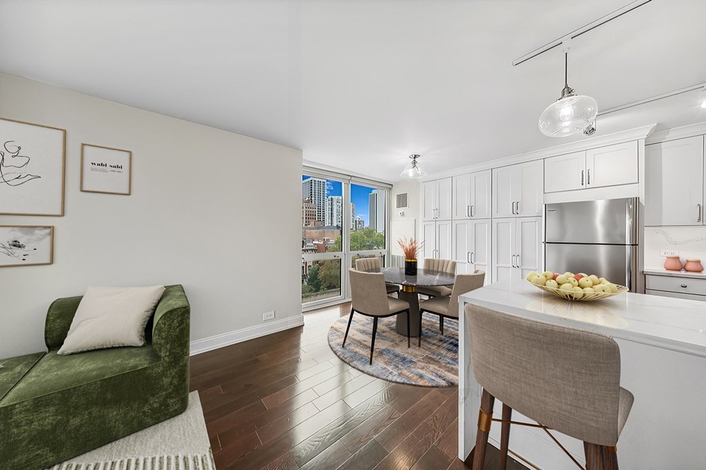 a living room with a kitchen and a dining room
