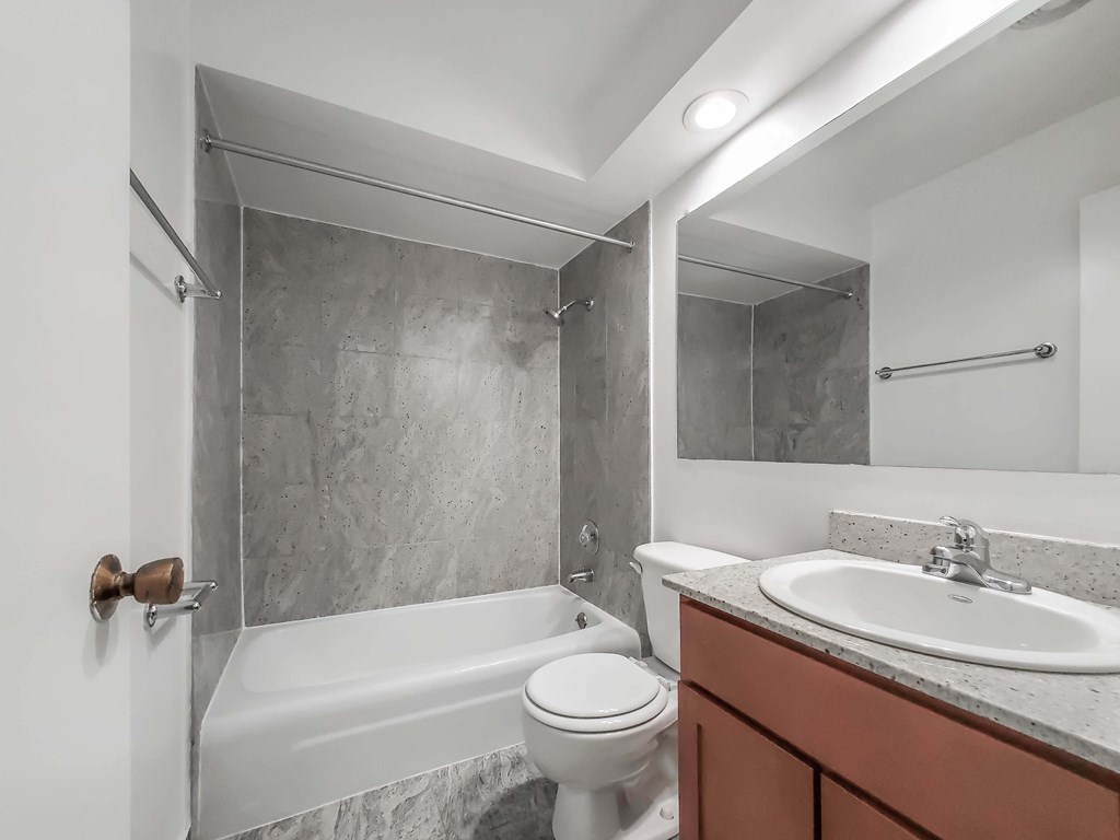 a bathroom with a sink toilet and bathtub