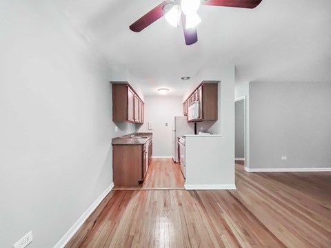 a kitchen and dining area in a 555 waverly unit
