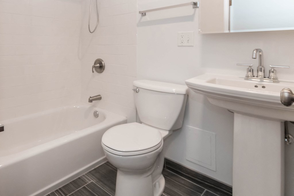 a bathroom with a toilet sink and bathtub