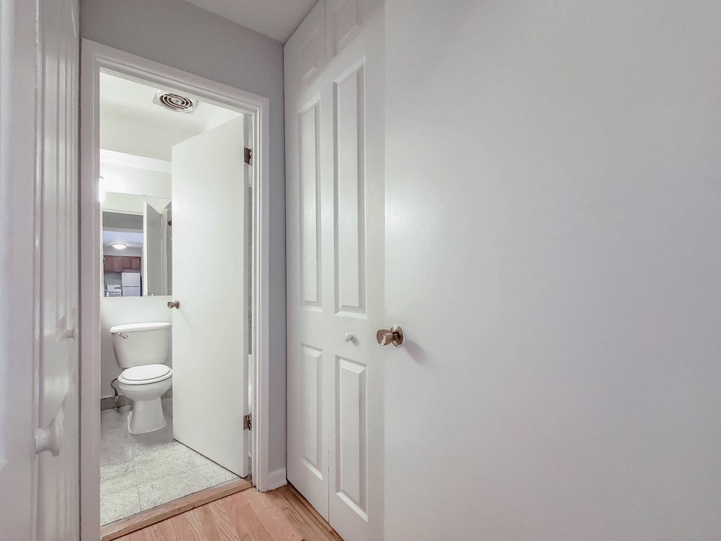 a bedroom with a bed and a mirror