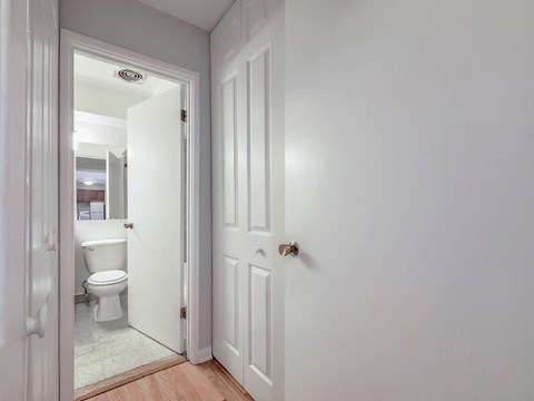 a bedroom with a bed and a mirror