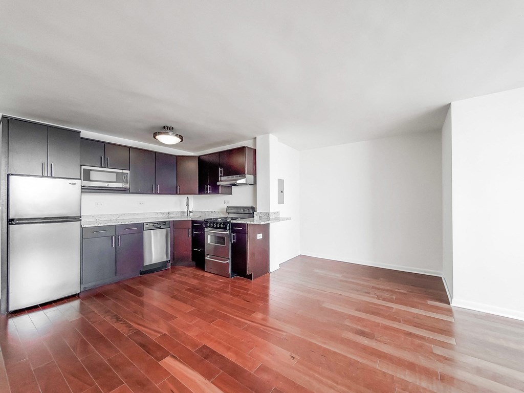 a kitchen and living room in a 555 waverly unit