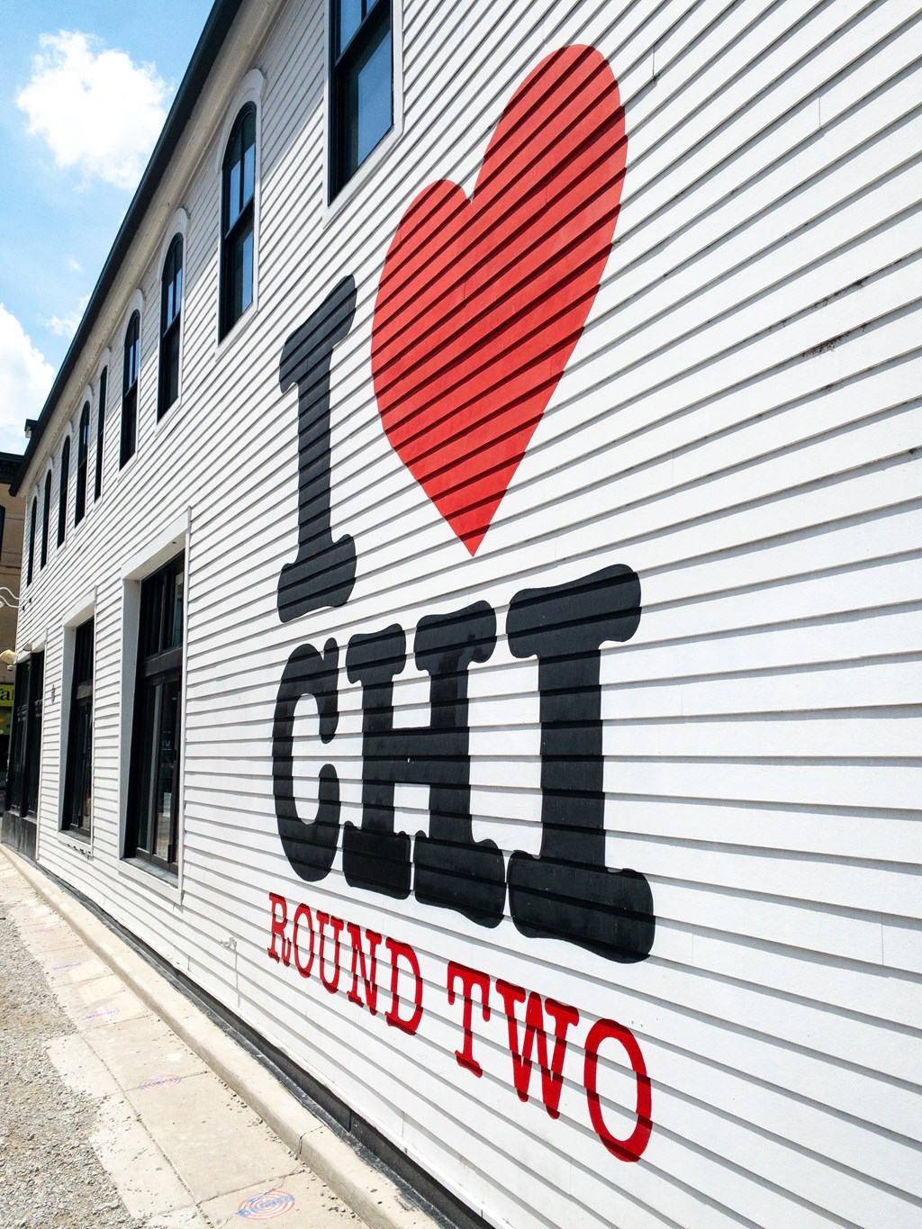 a white building with a red heart and the words i love chi
