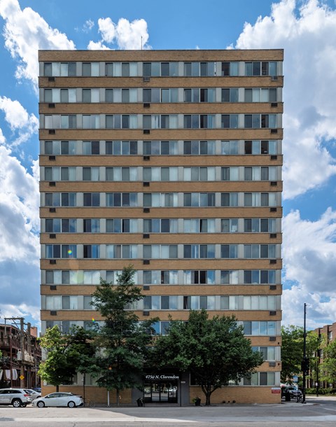 Clarendon Shores apartments in Uptown Chicago, brick high-rise with rows of windows and tree-lined entrance.