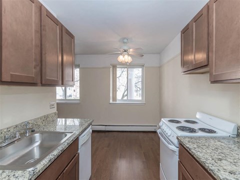 a kitchen with a stove and a sink