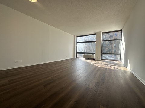 Spacious living room with wooden floors