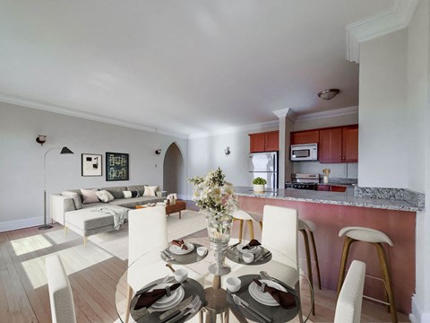 Open living, dining, and kitchen with breakfast bar and glass table at The Patricians, Lincoln Park, Chicago.