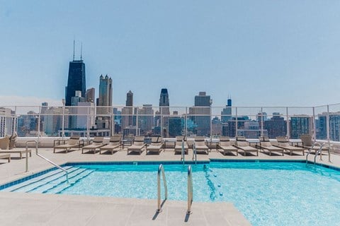 Astor House rooftop pool with lounge chairs overlooking the Gold Coast Chicago skyline.